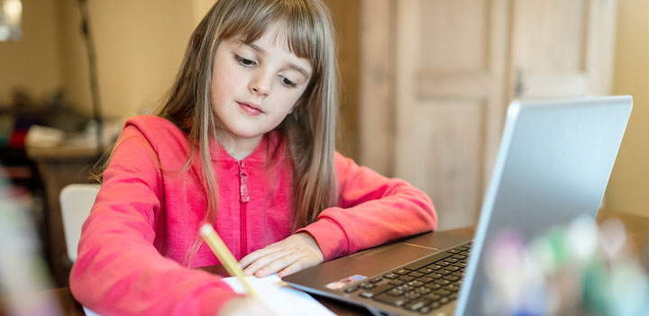 elementary school student on computer at home